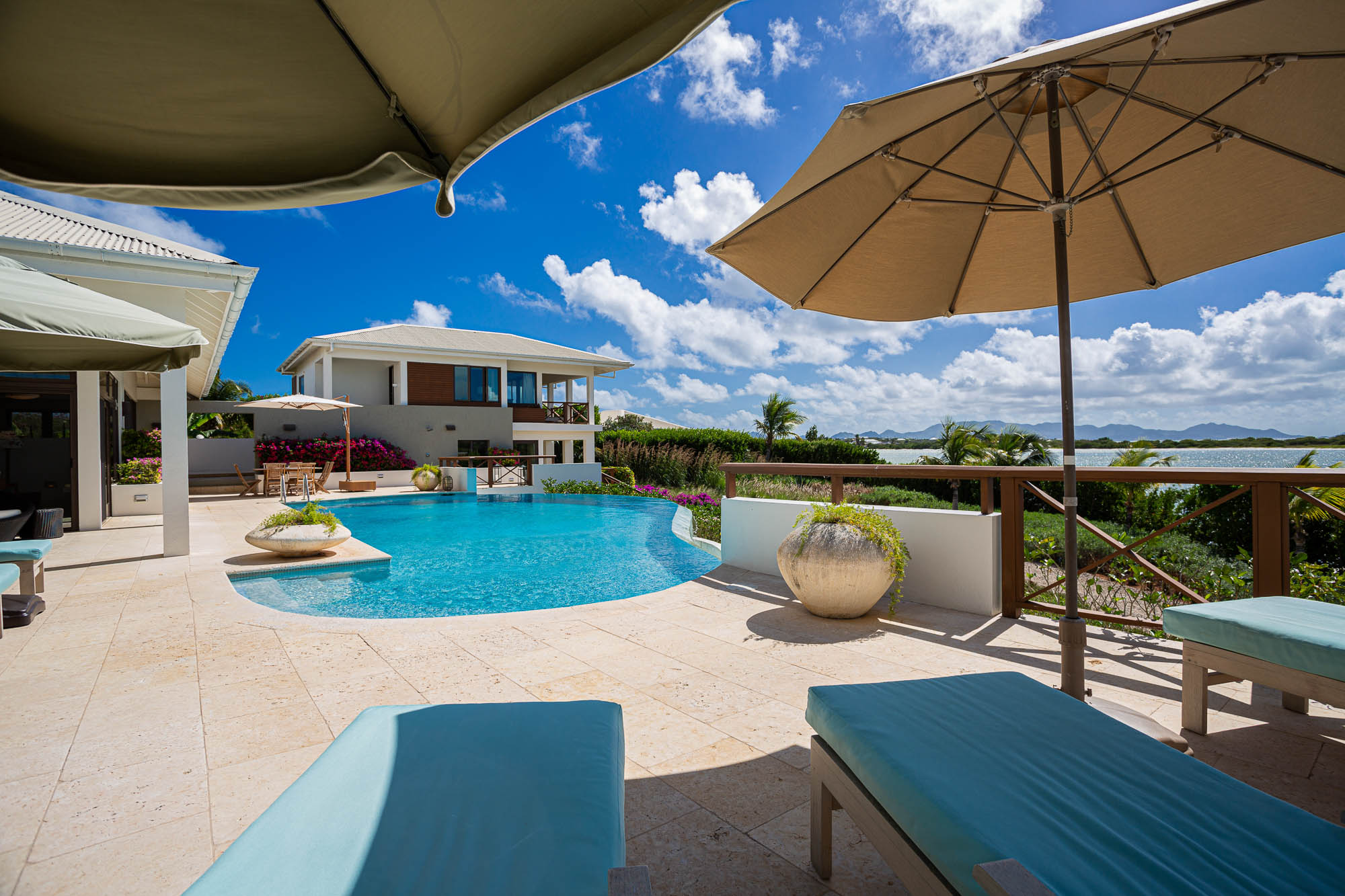 Pool terrace and outdoor dining facing Rendezvous Bay
